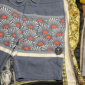 VISSLA Navy and Orange Sunburst board Shorts 8”